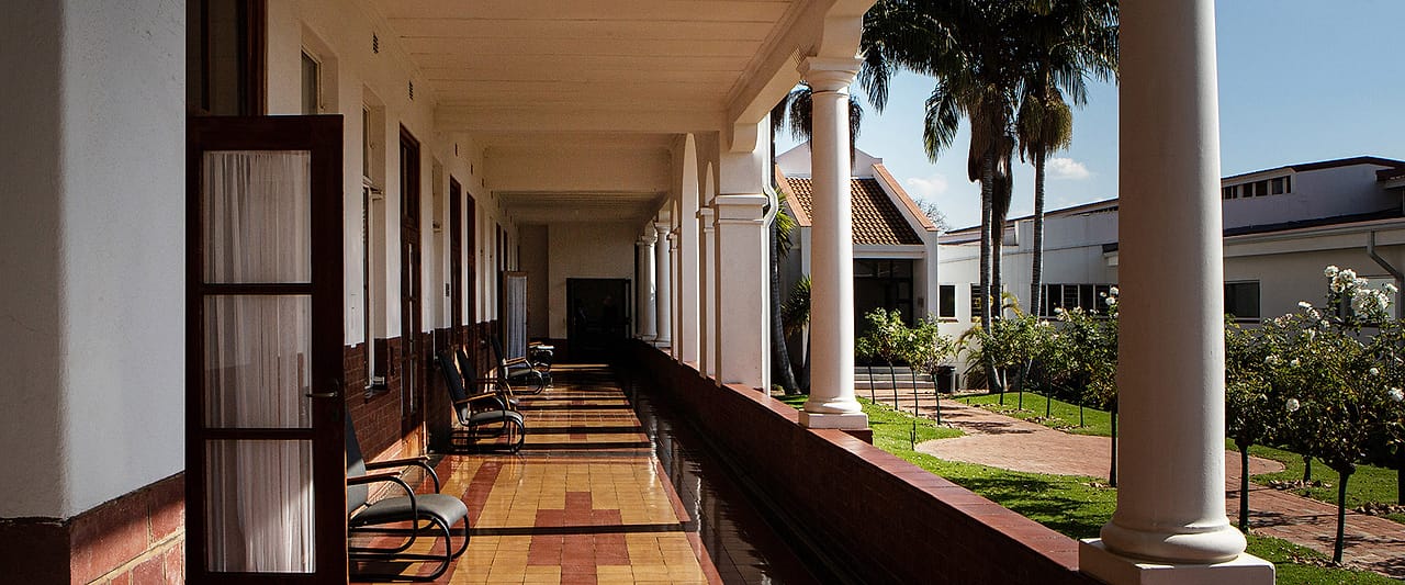 The long tiled colonnade running the length of the original hospital wing.