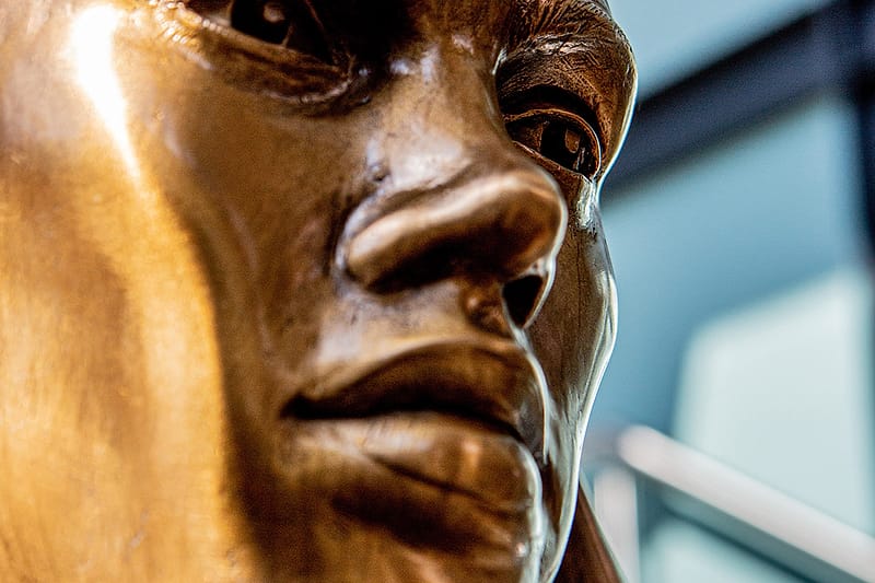 The face of the bronze Little Company of Mary nursing sister.